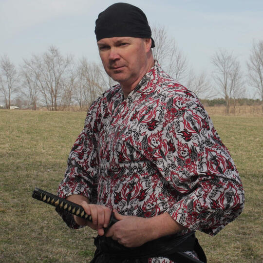 Samurai Dan posing with a sword